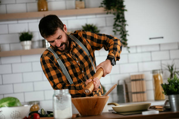 istock Young man preparing delicious food. 1265517952