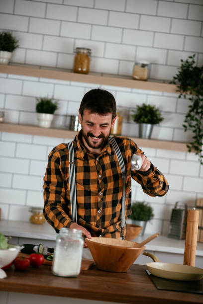 istock Young man preparing delicious food. 1265520167