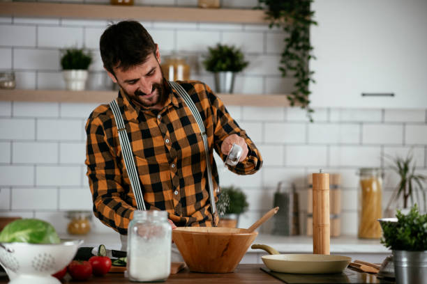 istock Young man preparing delicious food. 1265520601