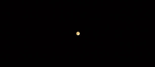 istock Full moon in the black sky. Mysterious photo. 1265521327