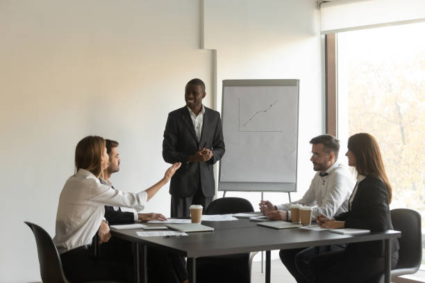 istock African American male presenter interact with audience 1265522933