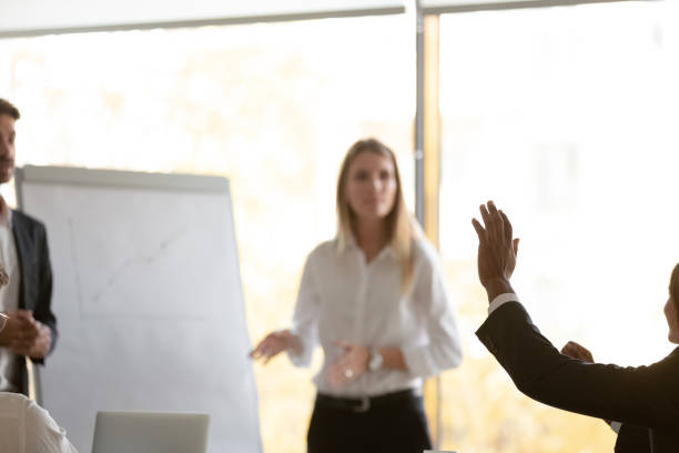 istock Motivated employee raise hand interacting with coach 1265522967