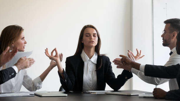 istock Peaceful female ceo keep calm ignoring annoying clients 1265525120