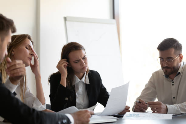 istock Frustrated colleagues feel stressed because of paperwork problems 1265525122