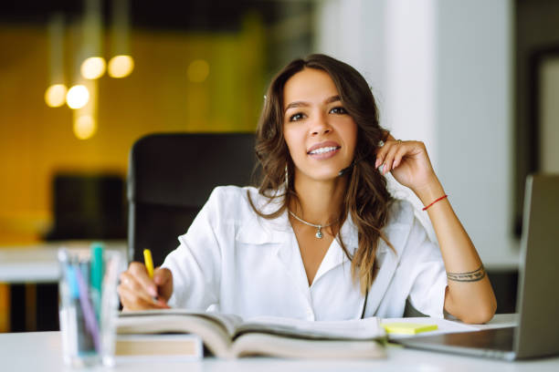 istock Young woman student wear wireless headphone study online. 1265531079