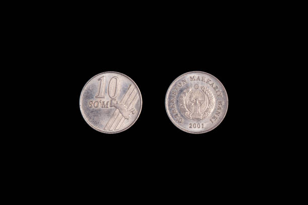 istock 10 Uzbek som coin 2001 on a black background. close-up on both sides 1265531118