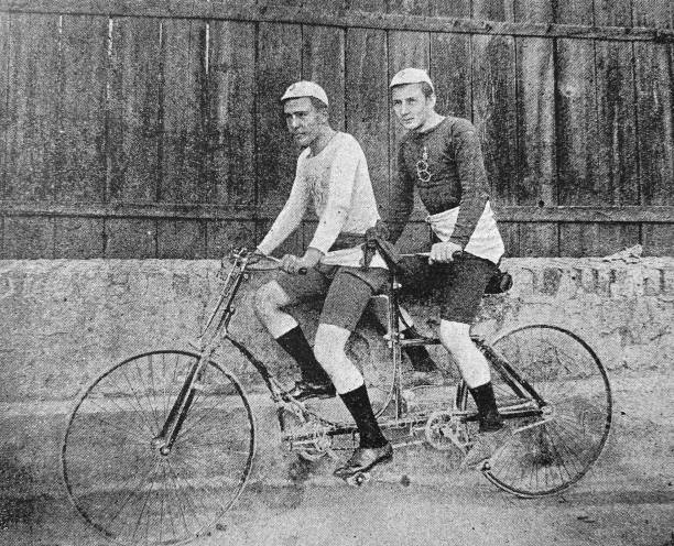 istock Cyclists H. Bahner, C. Jung, Vienna bicycle club, both on tandem, outdoor, side view 1265531662