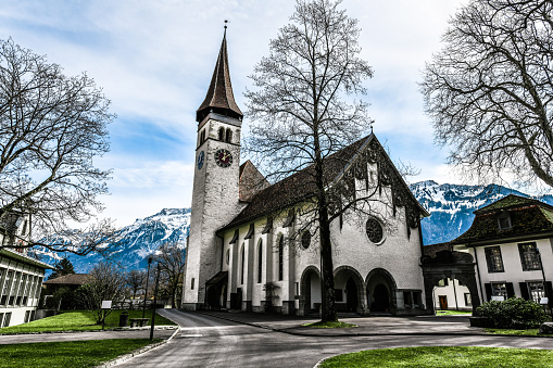 Church And Clocktower With Courtyard In Interlaken, Switzerland