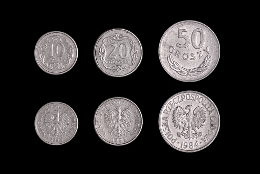 set of Polish coins, 10 20 50 groszy on a black background