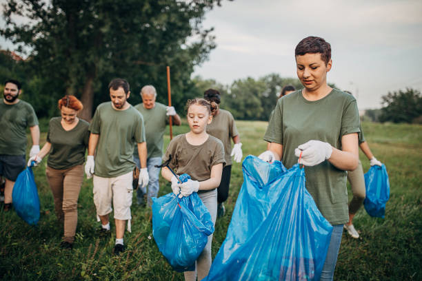 istock Environmental volunteers cleaning public park 1265544670