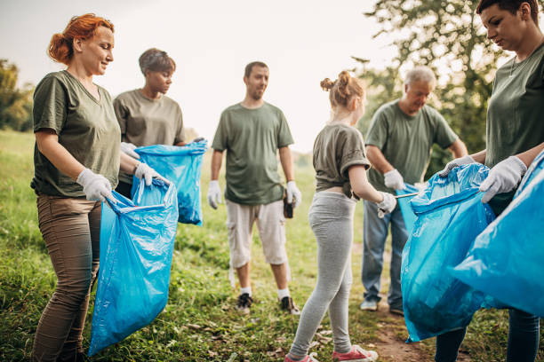 istock Environmental volunteers collecting garbage from the park 1265544781
