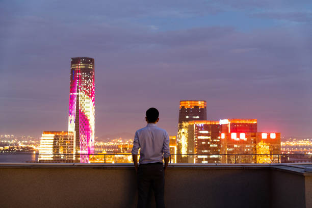 istock Businessman looking at cityscape on the rooftop 1265544882