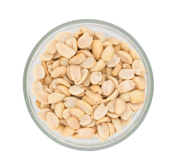 istock Natural Salted Peanuts on White Background 1265547674