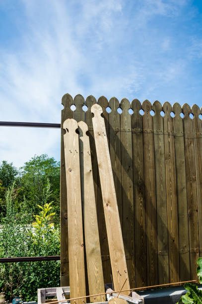 istock Installing a wooden fence. A few boards aren't attached yet. 1265548191