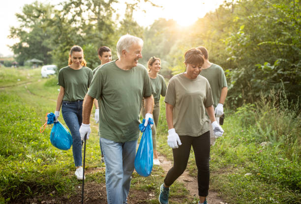 istock Multi-ethnic group of volunteers are happy about work they done for environment 1265548653