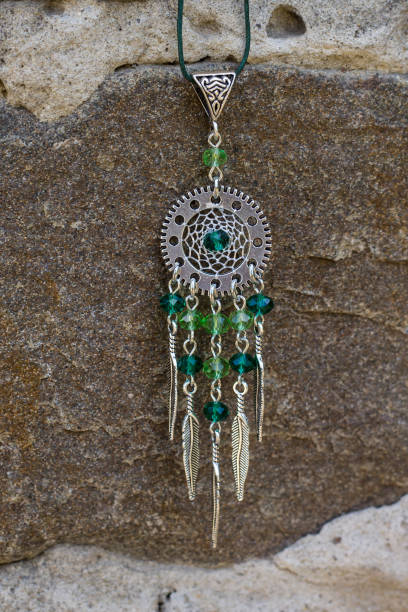 istock Handmade dream catcher with feathers threads and beads rope hanging 1265548766