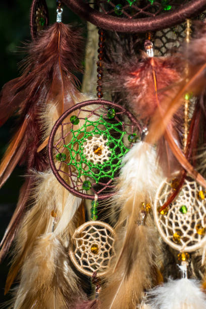 istock Handmade dream catcher with feathers threads and beads rope hanging 1265548805