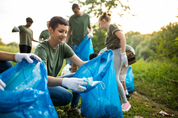 istock Volunteers cleaning environment together 1265548850