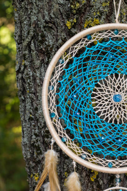 istock Handmade dream catcher with feathers threads and beads rope hanging 1265548938
