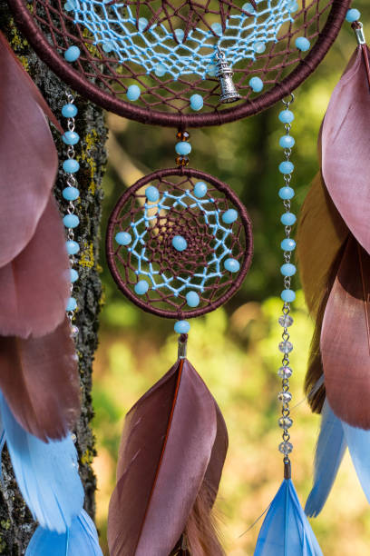 istock Handmade dream catcher with feathers threads and beads rope hanging 1265548942