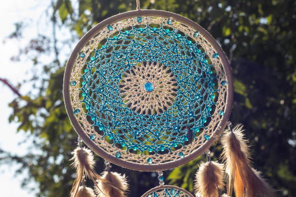 istock Handmade dream catcher with feathers threads and beads rope hanging 1265549009