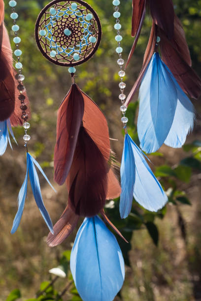 istock Handmade dream catcher with feathers threads and beads rope hanging 1265549012