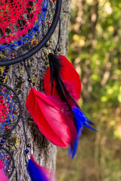istock Handmade dream catcher with feathers threads and beads rope hanging 1265549025