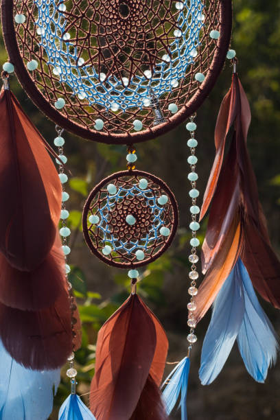 istock Handmade dream catcher with feathers threads and beads rope hanging 1265549039