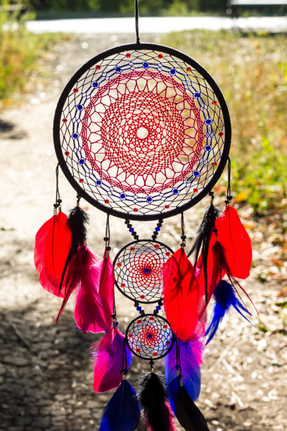 istock Handmade dream catcher with feathers threads and beads rope hanging 1265549055