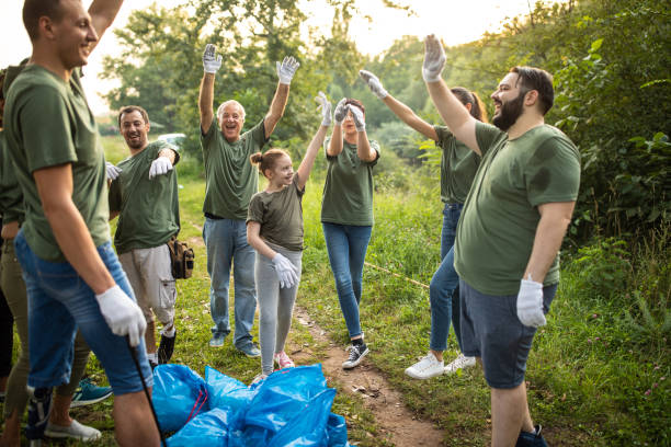 istock Happy environmental volunteers at public park 1265549082