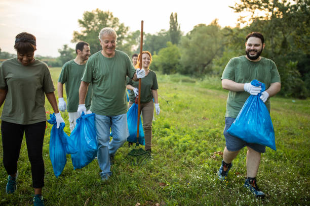 istock Multi-ethnic group of volunteers are happy about work they done for environment 1265549204