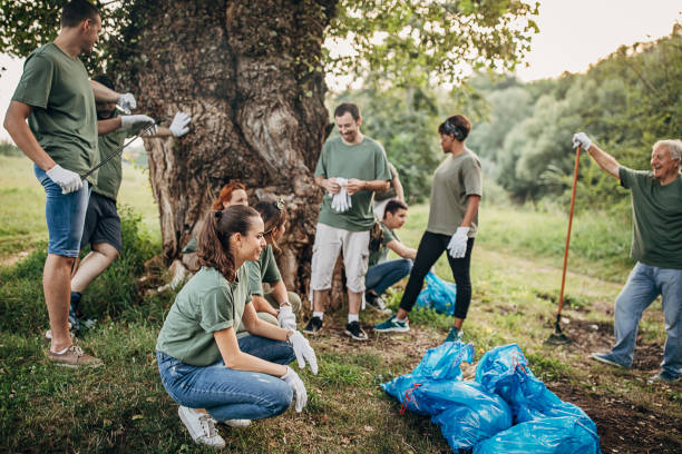 istock Volunteers resting after cleaning nature from garbage 1265549247