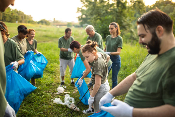 istock Volunteers cleaning environment together 1265549307