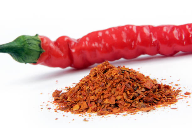 istock Red chili peppers and flakes 1265550559