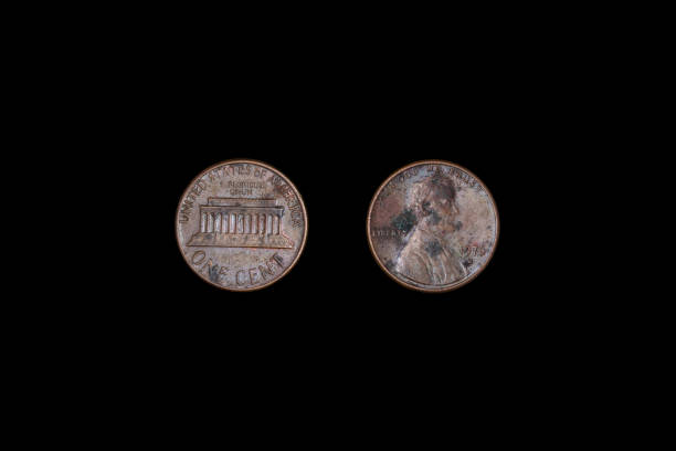 istock Usa one cent 1976 on a black background. close-up on two sides 1265550834