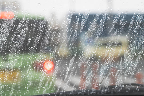 istock Rain hitting the windshield of a car 1265552282
