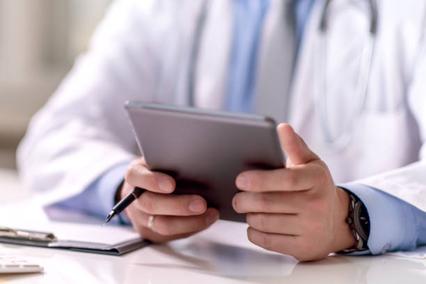 istock Close up of doctor working in office 1265552578