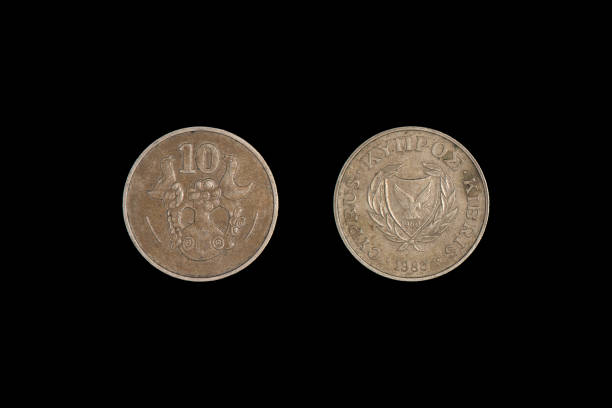 istock old coin ten cent Cyprus 1983, black background close-up 1265553508