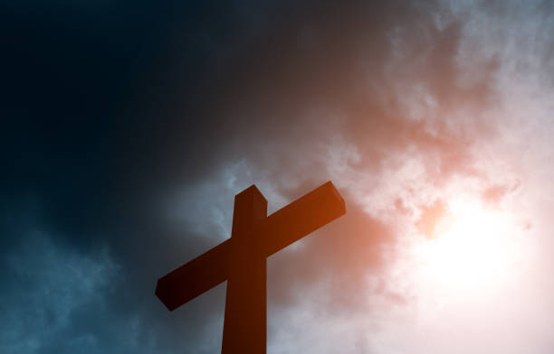 istock Religious cross under the cloudy sky 1265554989