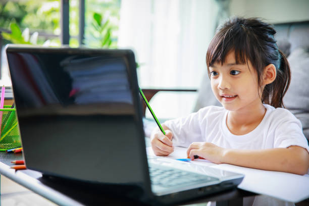 istock two asian sisters playing together at home 1265556854