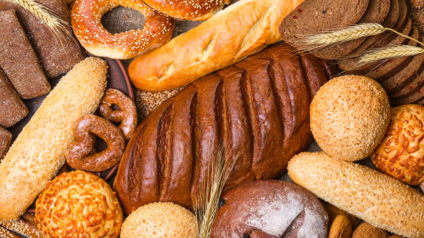 istock Fresh bread and bakery in the form of background 1265557151