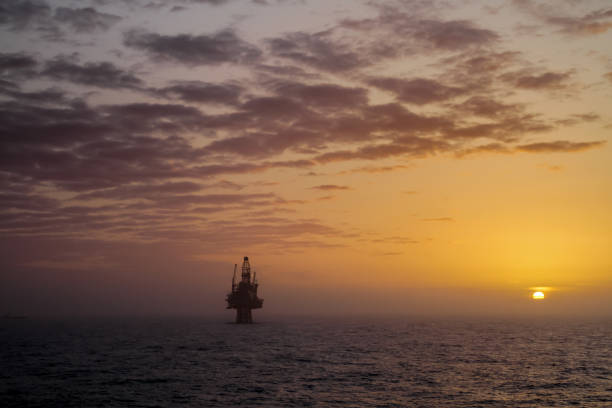 Oil platform Ringhorn at sunset in the North Sea NORTH SEA, NORWAY - 2011 APRIL 09. Oil platform Ringhorn at sunset in the North Sea north sea oil and gas stock pictures, royalty-free photos & images