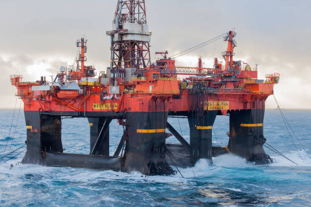 istock Semi Submersible rig West Alpha deballasting and ready for rig move in Norwegian harsh weather condition. 1265573024