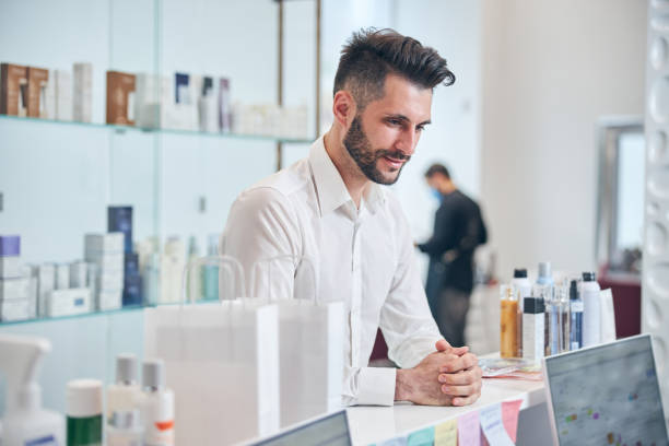 istock Kind bearded male person talking to administrator 1265573202