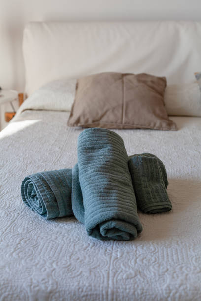 istock Green Towels on Bed 1265574615