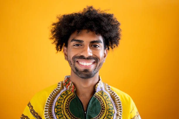 Studio close-up of happy 24 year old mixed race man