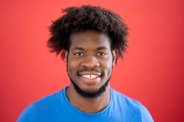 istock Studio headshot of casual young black man smiling at camera 1265576298