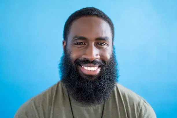 Photo of Portrait of cheerful mid adult black man in casual clothing