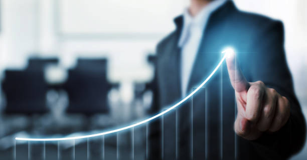 istock Businessman pointing arrow graph corporate future growth plan with blurred background office. Business development to success and growing growth concept. 1265588111