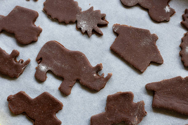 istock baking chocolate cut out cookies with kids 1265594541